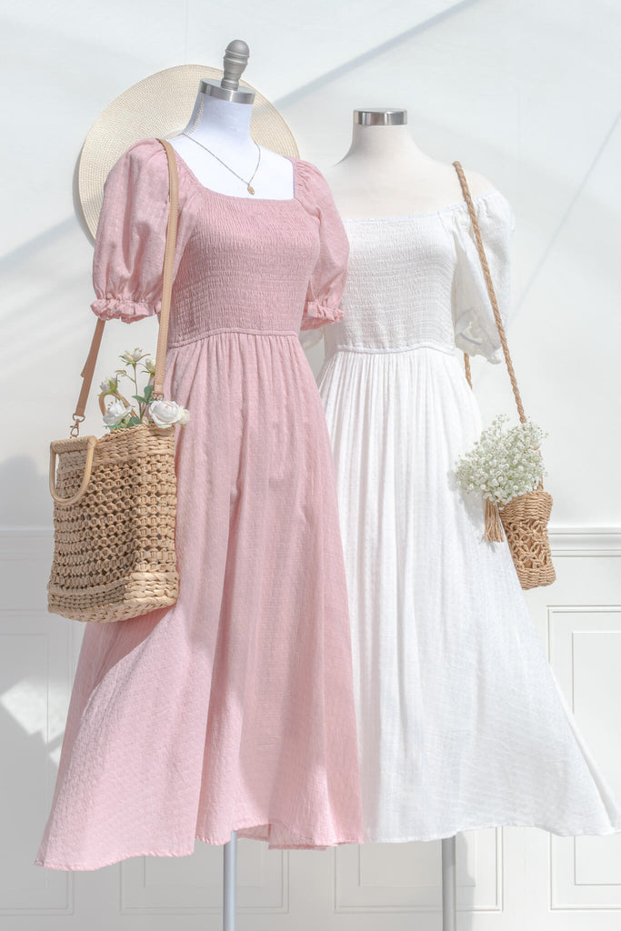 two beautiful cottage core style dresses, one a pink dress, the other a white dress. 