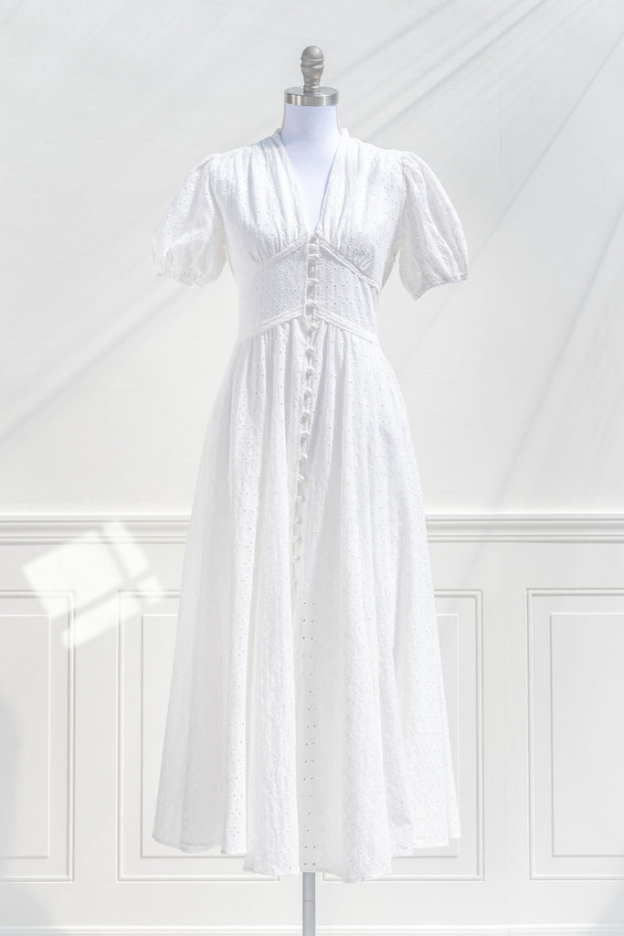 boutique cottagecore dresses - a lovely white dress with button-down feature, and puff sleeves. front view. amantine.