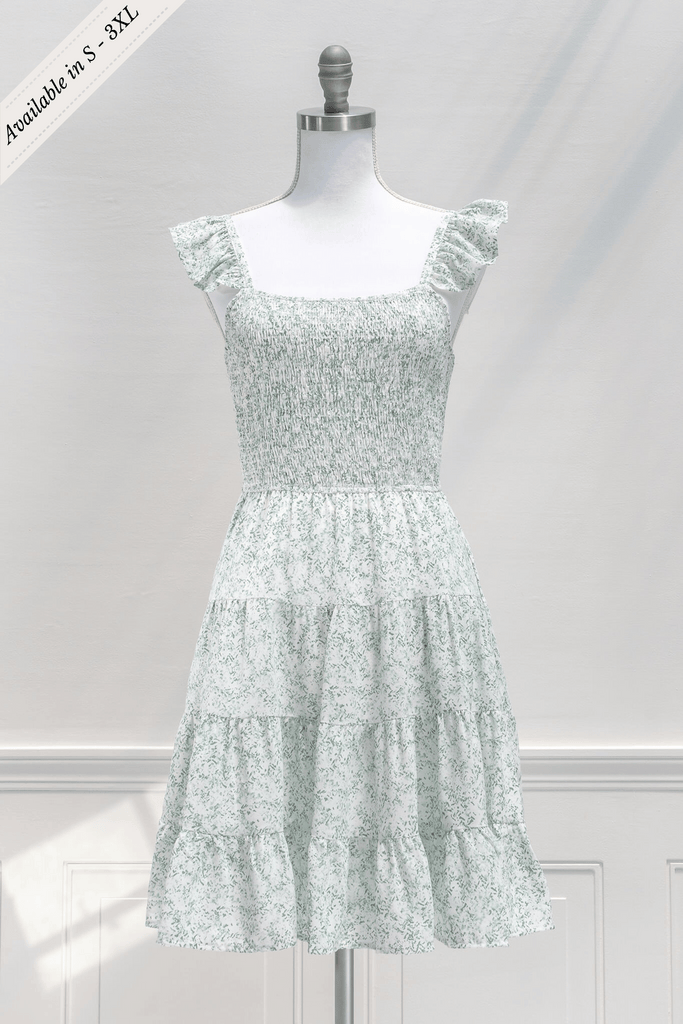 aesthetic dresses - french and vintage style mini dress from amantine - features a square neckline, ruched midriff, pockets, and a light green floral print - front view 