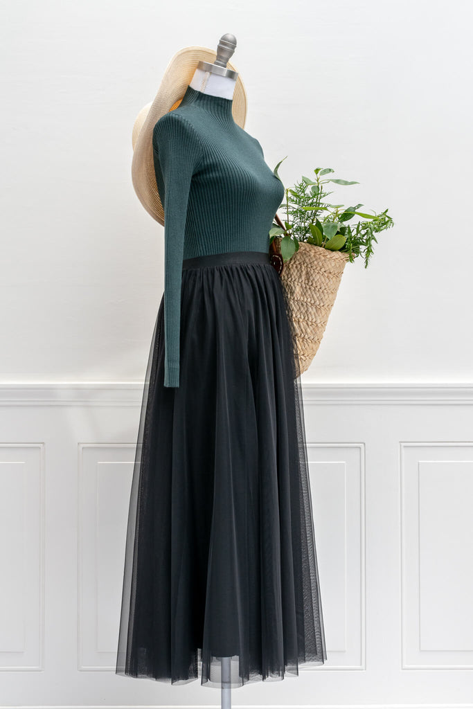 feminine aesthetic clothing - a long maxi skirt in black color and tulle fabric - french girl autumn style - amantine - styled with hat and green shirt view