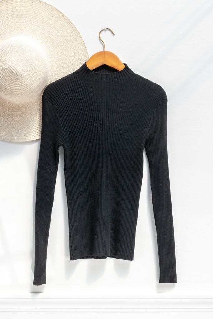 feminine clothing - a french girl style black knit long sleeve ribbed sweater - amantine - on a hanger view