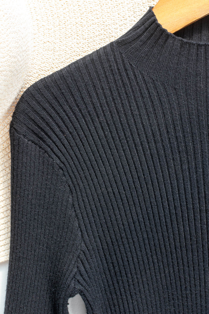 feminine clothing - a french girl style black knit long sleeve ribbed sweater - amantine - up close fabric  view