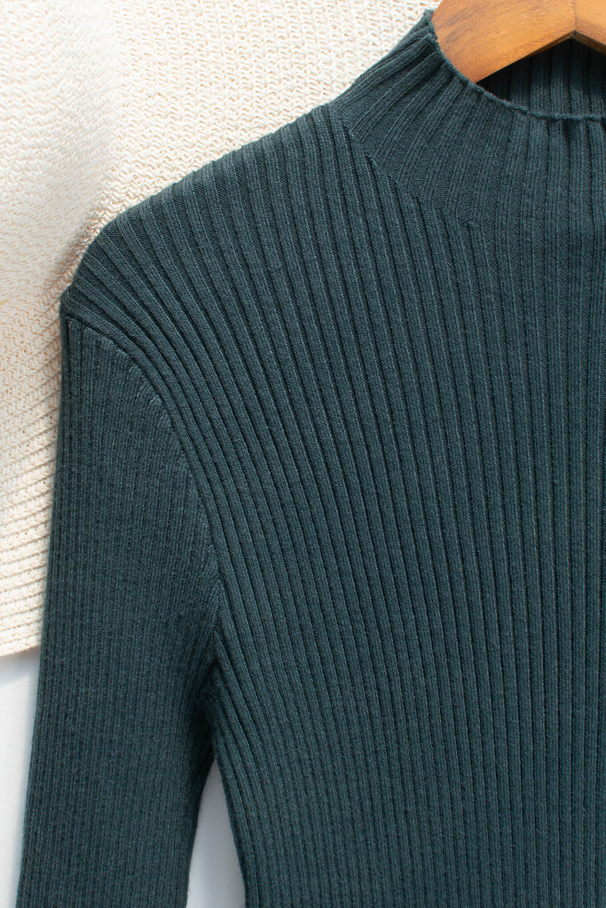 feminine clothing - a french girl style forest green knit long sleeve ribbed sweater - amantine - up close fabric view