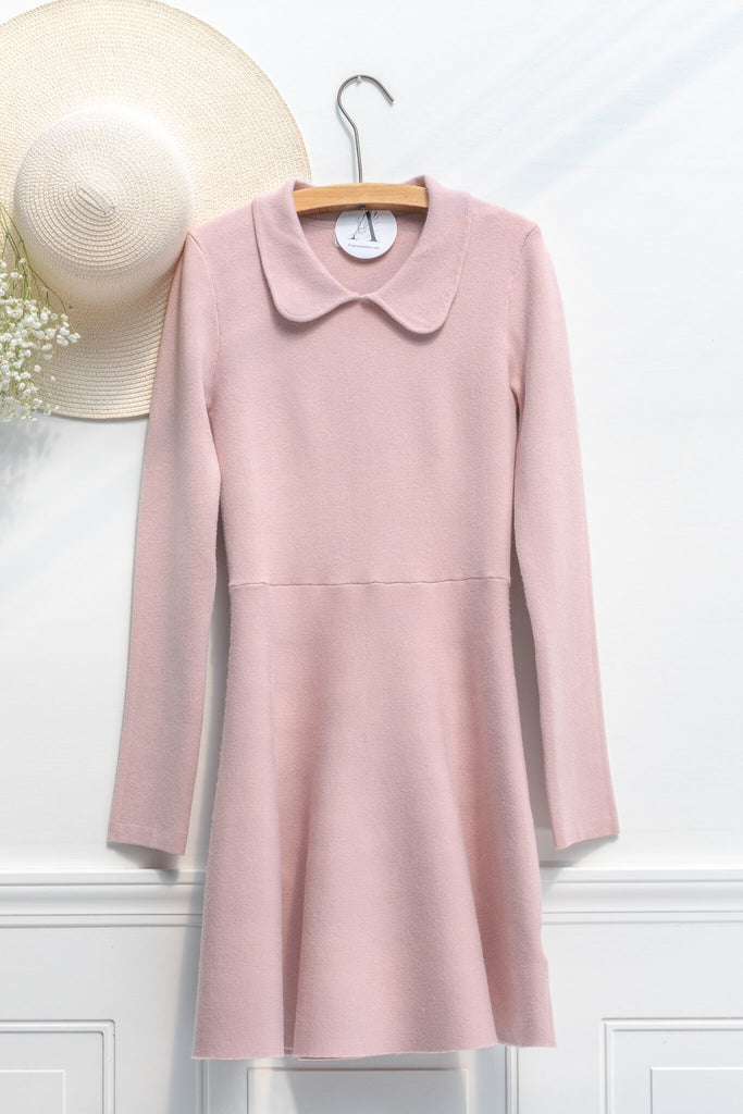 french dress / vintage aesthetic -mini dress in soft blush pink medium-weight knit features a peter-pan style collar, long sleeves, and a fit-and-flare silhouette - amantine - on hanger view