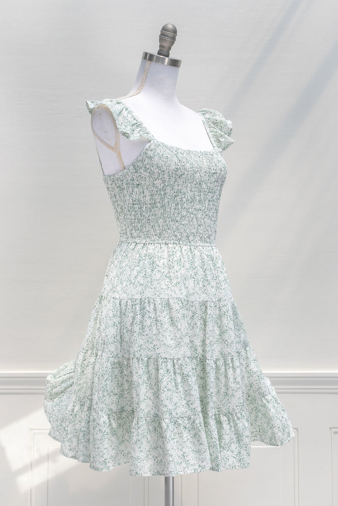 aesthetic dresses - french and vintage style mini dress from amantine - features a square neckline, ruched midriff, pockets, and a light green floral print - view 