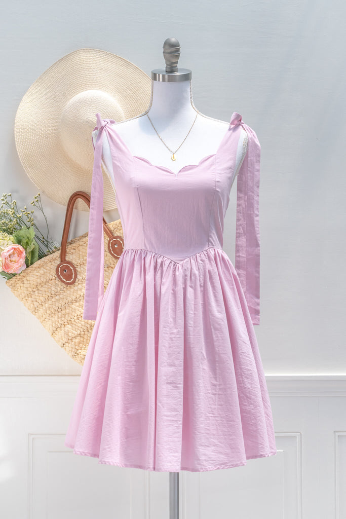 pink aesthetic dresses from amantine - a pink barbiecore mini dress, sweetheart neckline and tie shoulder straps - front view 