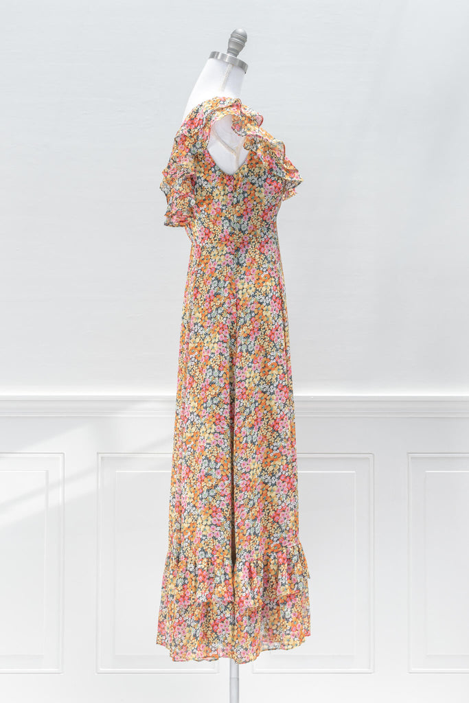 aesthetic dresses - french style -a bright floral print chiffon featuring a v-neckline, flutter shoulders, in an a line silhouette midi length - amantine dresses - side view  