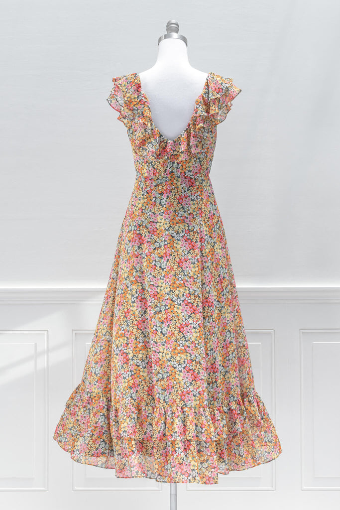 aesthetic dresses - french style -a bright floral print chiffon featuring a v-neckline, flutter shoulders, in an a line silhouette midi length - amantine dresses - back view  