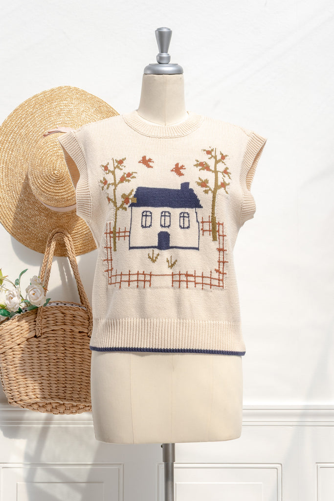 Amantine Homestead house-motif sweater vest in cream—oversized sleeveless fit and cropped length, front view