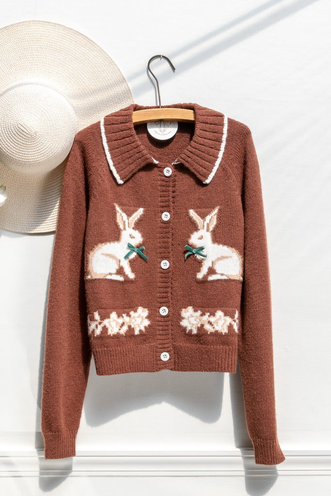 Amantine chestnut-brown rabbit cardigan with contrast-tipped collar, button front, and floral border — front view