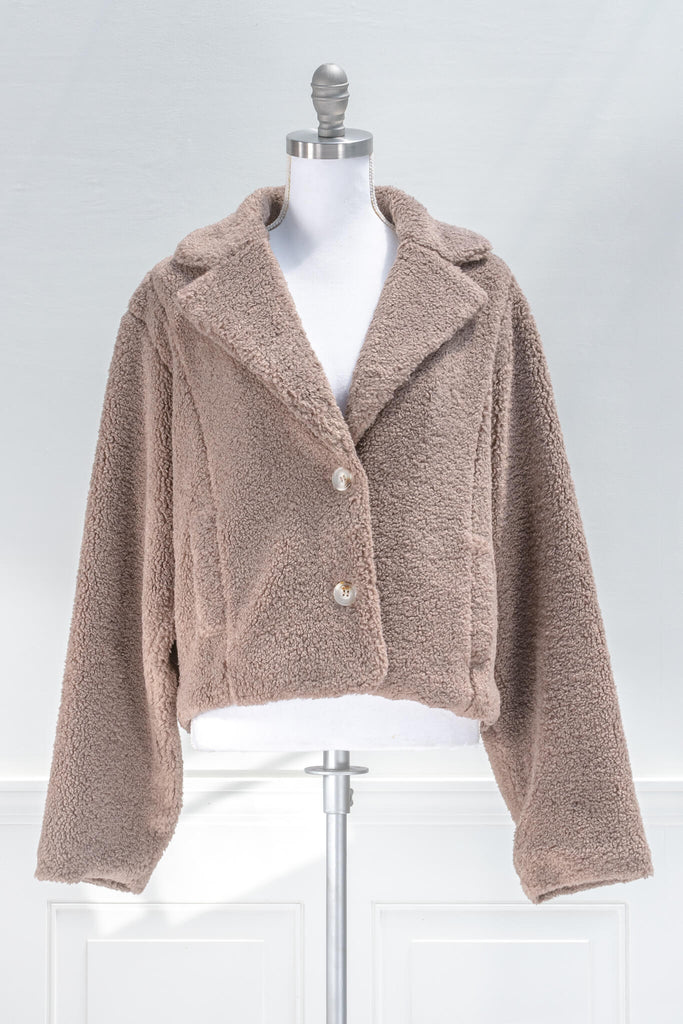 French feminine tops - a feminine winter sherpa coat in taupe - french and feminine outerwear - amantine - front view  
