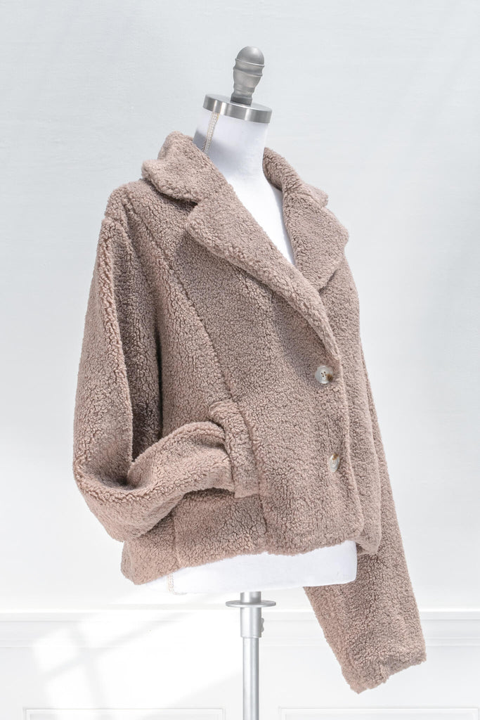 French feminine tops - a feminine winter sherpa coat in taupe - french and feminine outerwear - amantine - quarter view  