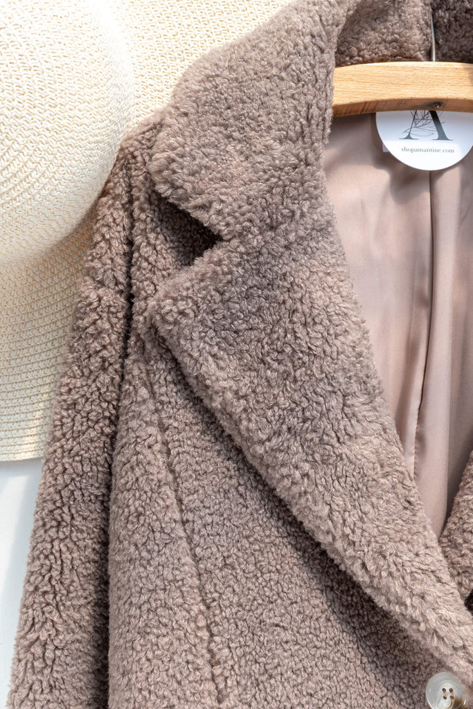 French feminine tops - a feminine winter sherpa coat in taupe - french and feminine outerwear - amantine - up close fabric view  