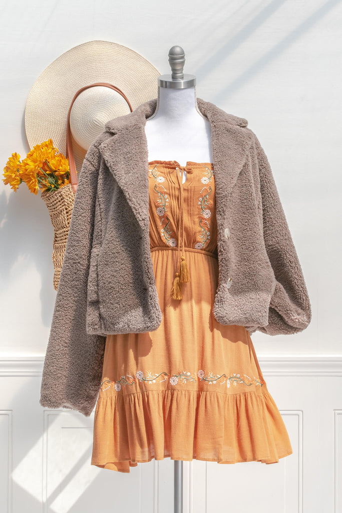 French feminine tops - a feminine winter sherpa coat in taupe - french and feminine outerwear - amantine - styled with autumn aesthetic dress view  