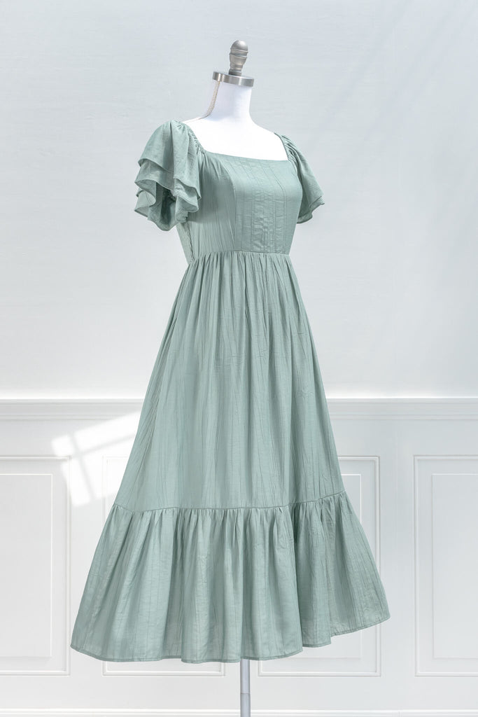 cottage core dress - a french and feminine style midi, with square neckline, and puff sleeves in green. Amantine - quarter view