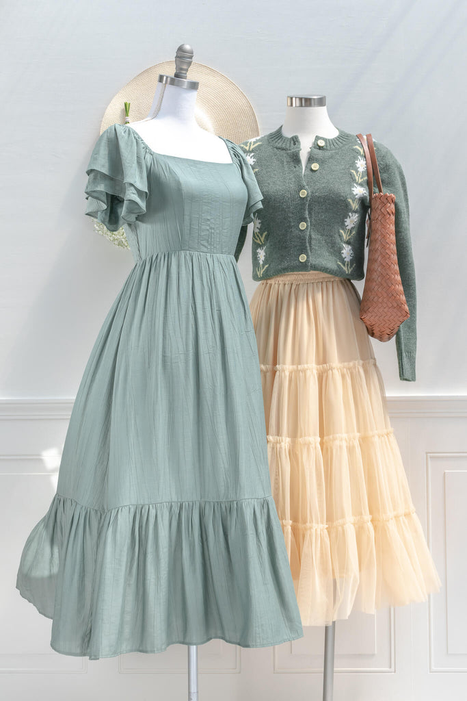 cottage core dress - a french and feminine style midi, with square neckline, and puff sleeves in green. Amantine - next to another cottagecore outfit view