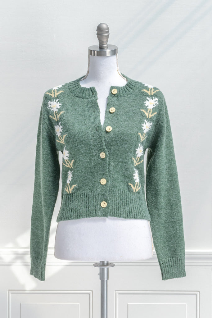 cottage core sweaters for autumn - a green wooly cardigan with floral motives cottagecore style- front view 