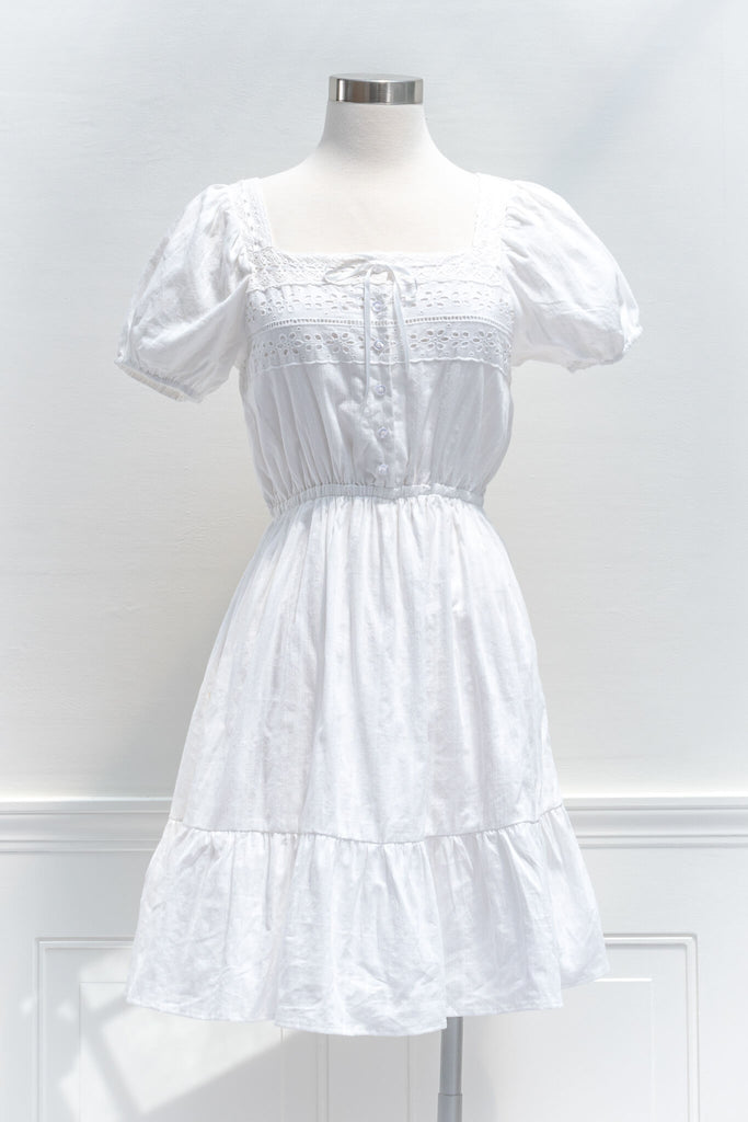 cottagecore dresses - a white eyelette cottagecore style square neckline and short sleeve mini dress - amantine - front view 
