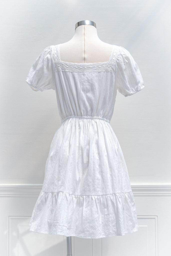 cottagecore dresses - a white eyelette cottagecore style square neckline and short sleeve mini dress - amantine - back view 