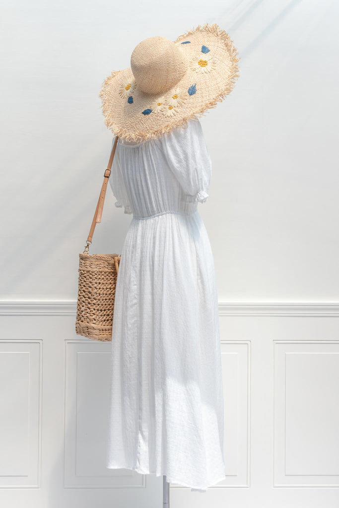 aesthetic beach hat - feminine french style woven sun hat with flower motif on brim styled with a white dress