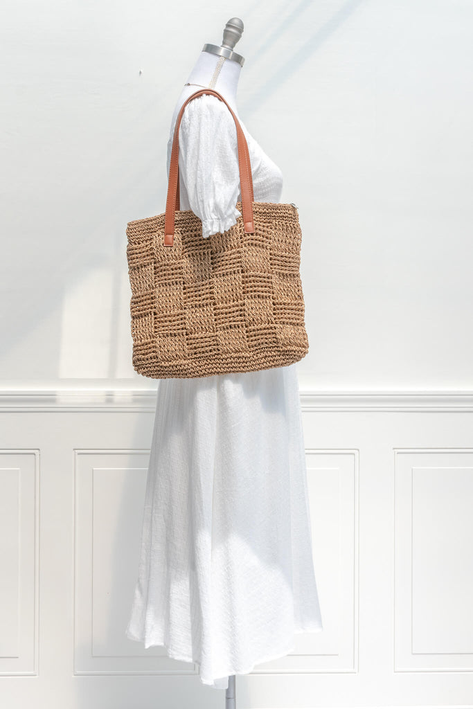 french market woven tote - a square pattern large tote in tan with brown straps styled with a long white dress
