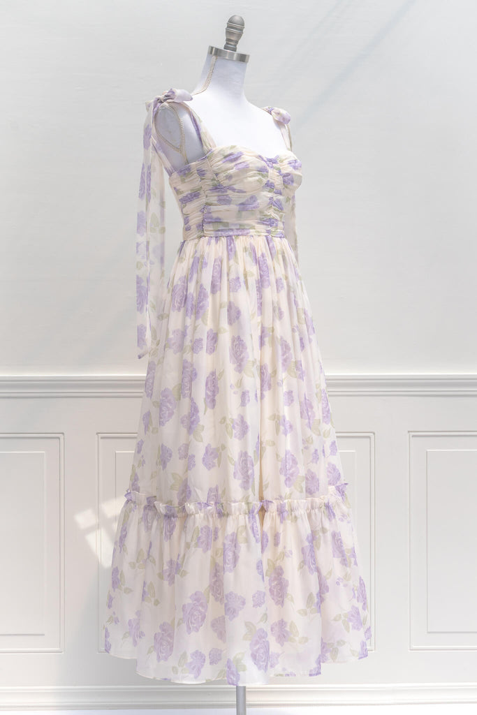 aesthetic clothes - amantine - a feminine french dress in lavender floral print with tie shoulder straps - amantine - quarter view
