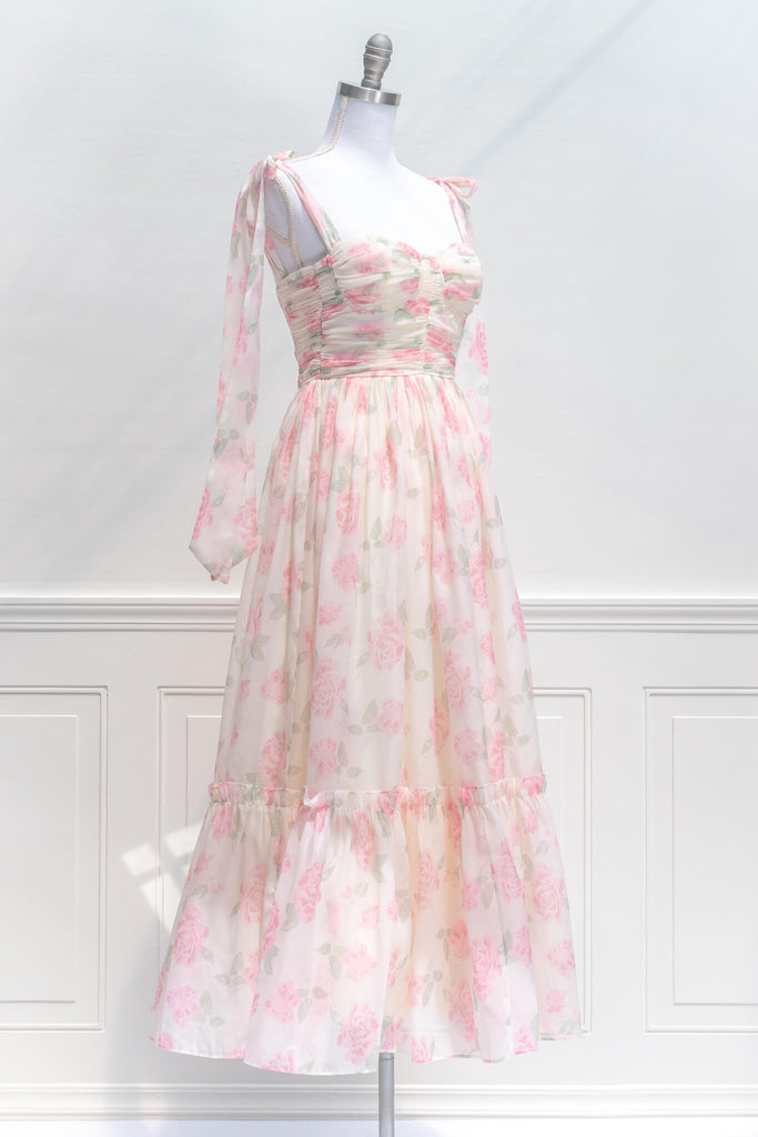 aesthetic clothes - amantine - a feminine french dress in pink floral print with tie shoulder straps - amantine - quarter view