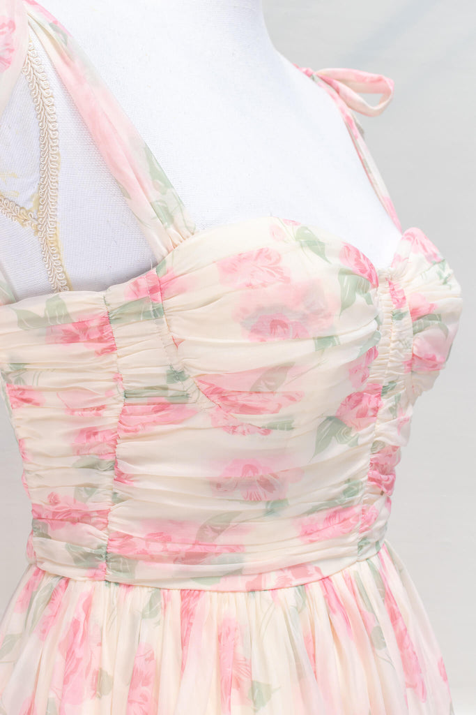 aesthetic clothes - amantine - a feminine french dress in pink floral print with tie shoulder straps - amantine - fabric detail view