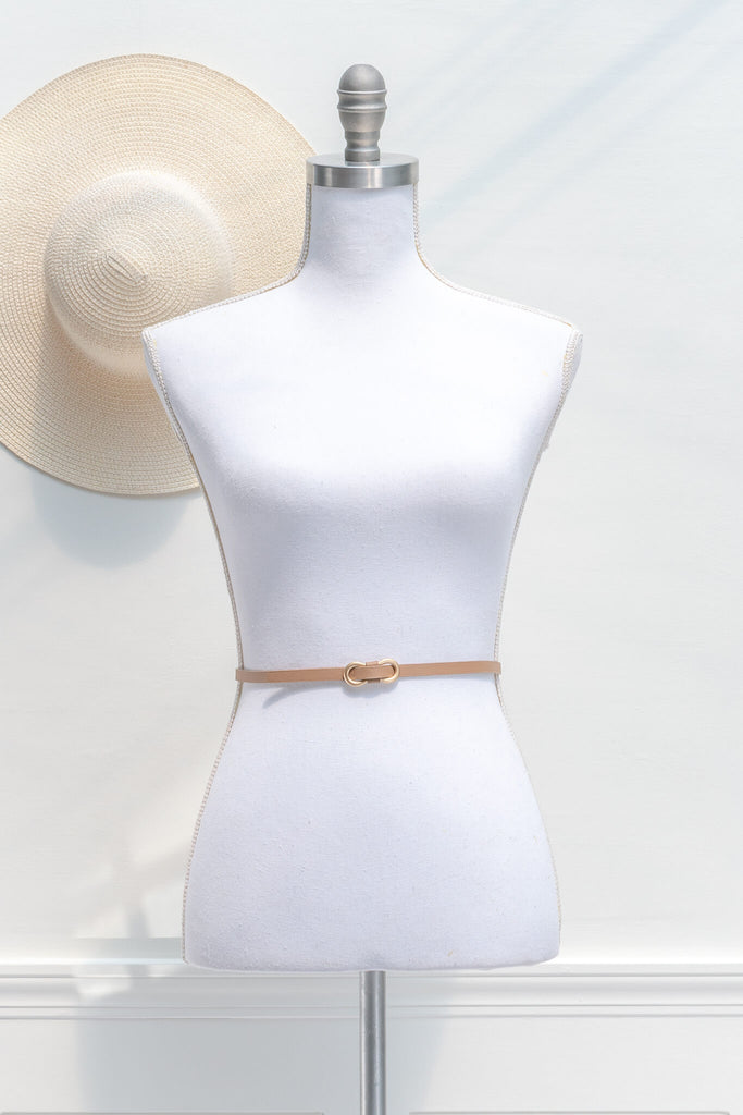 feminine, french style aesthetic  women's accessories - a beige thin waist belt with gold buckle - feminine neck scarf  - amantine
