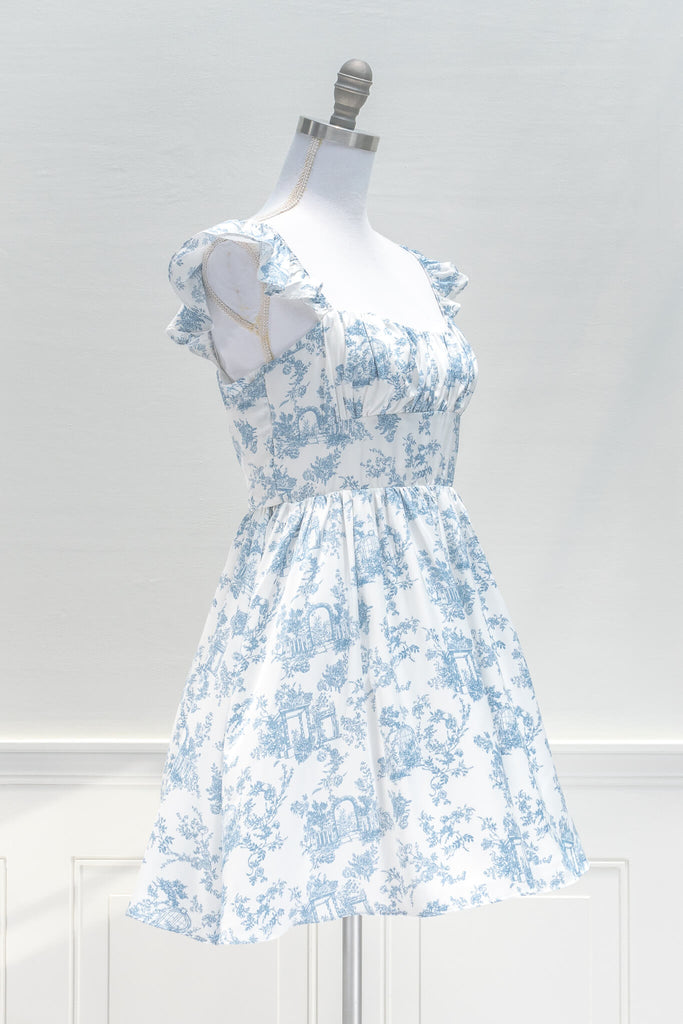 vintage style dresses inspired by french fashion - a beautiful mini dress in blue and white toile print fabric - summer dress - amantine - quarter view 
