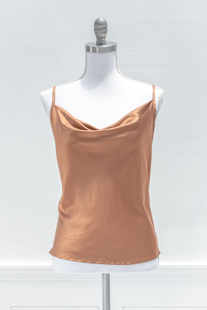 Chic and feminine, the Vivienne camisole in burnt sienna satin is a must-have for the French-aesthetic wardrobe. Featuring a relaxed fit, adjustable shoulder straps, and a flattering cowl-style neckline - aesthetic clothes - amantine - front view
