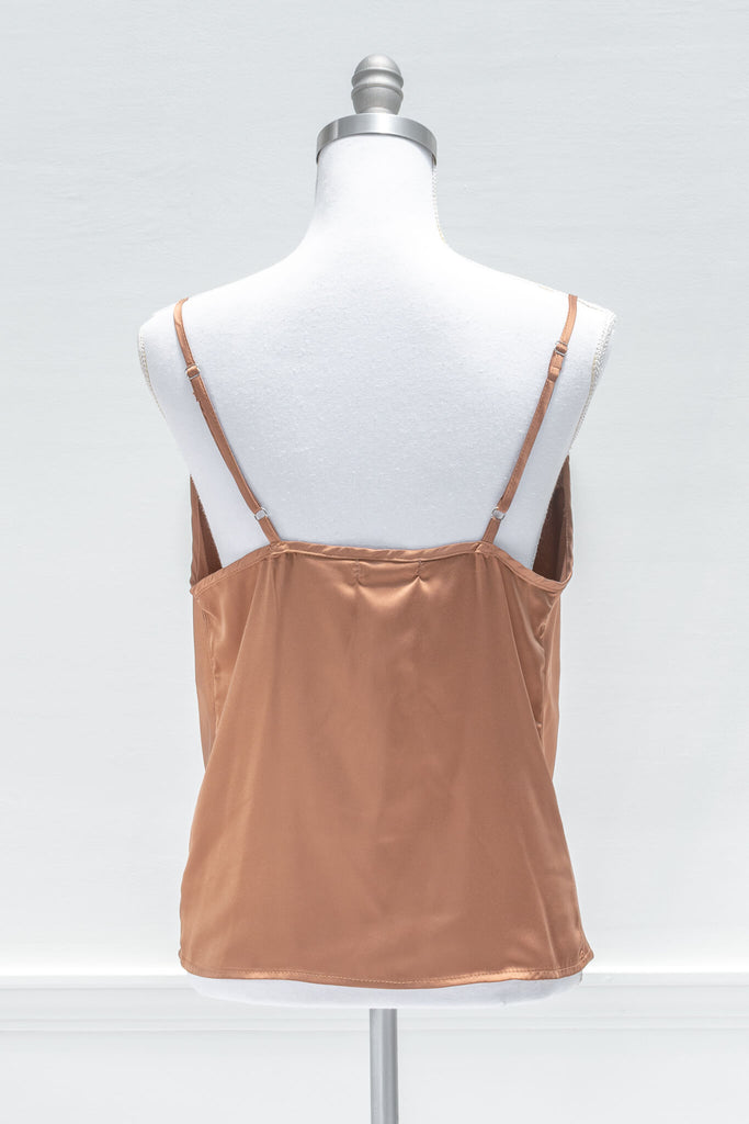 Chic and feminine, the Vivienne camisole in burnt sienna satin is a must-have for the French-aesthetic wardrobe. Featuring a relaxed fit, adjustable shoulder straps, and a flattering cowl-style neckline - aesthetic clothes - amantine - back view