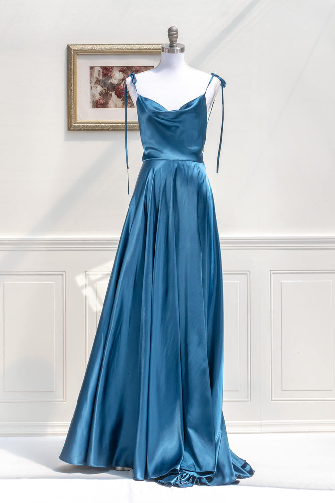 affordable formal gown for events. a long sapphire blue elegant formal dress with cowl neck and spaghetti straps. FRont view. Amantine. 