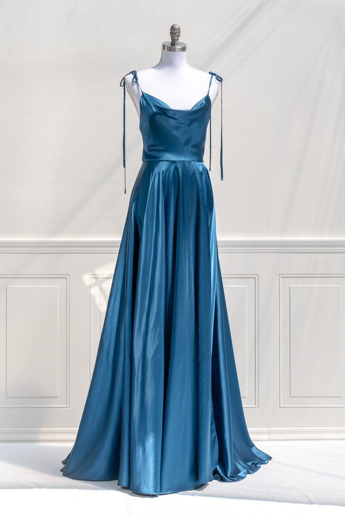 affordable formal gown for events. a long sapphire blue elegant formal dress with cowl neck and spaghetti straps. FRont view. Amantine. 