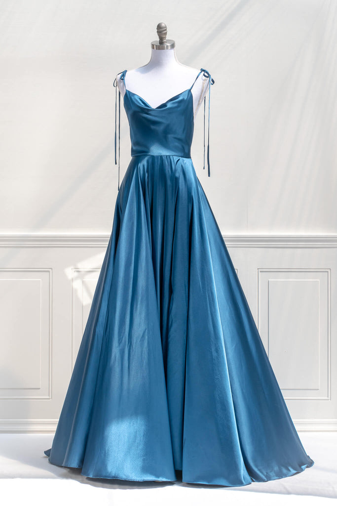 affordable formal gown for events. a long sapphire blue elegant formal dress with cowl neck and spaghetti straps. FRont view. Amantine. 