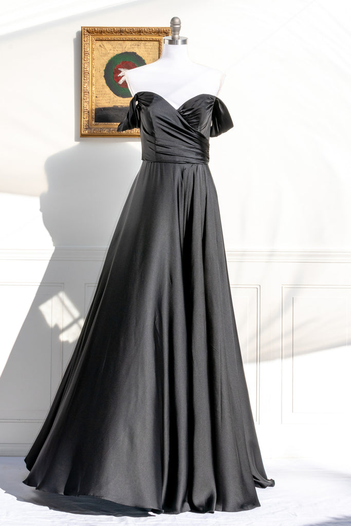 long black formal gown with structured bodice and wide skirt. a line. off the shoulder. feminine french style. 