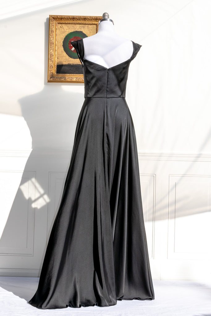 long black formal gown with structured bodice and wide skirt. a line. off the shoulder. feminine french style. 