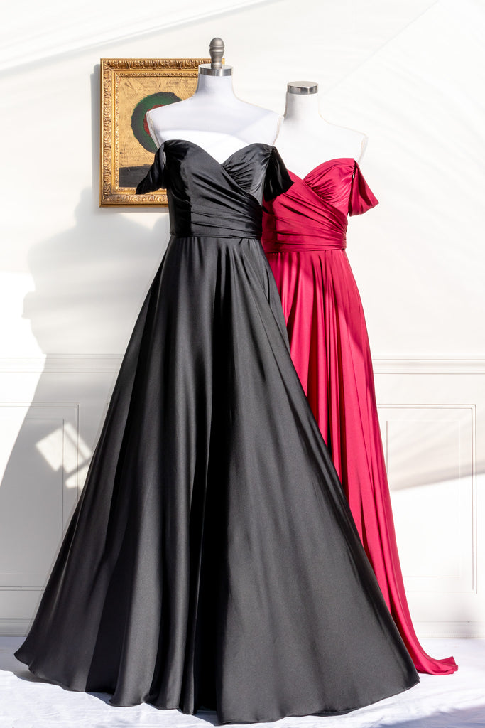 long black formal gown with structured bodice and wide skirt. a line. off the shoulder. feminine french style. 