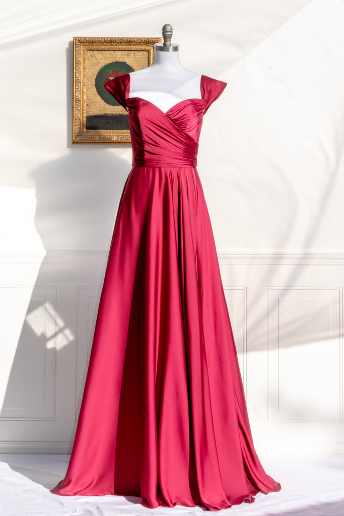 long red formal gown with structured bodice and wide skirt. a line. off the shoulder. feminine french style. 