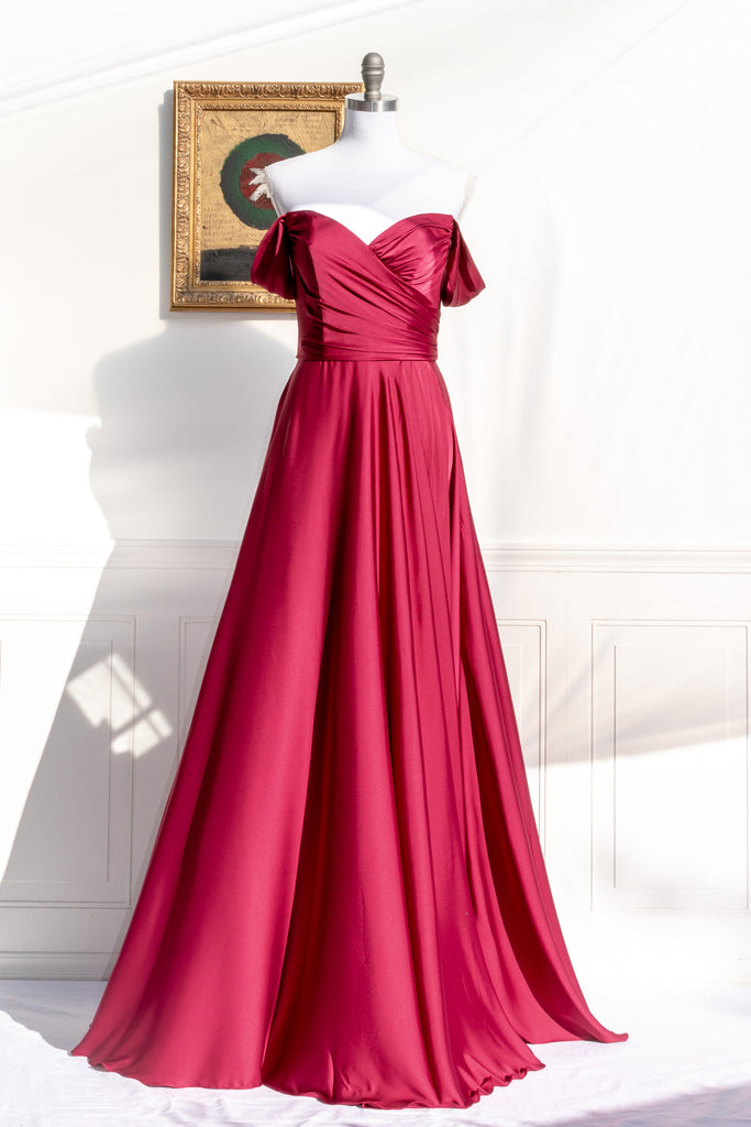 long red formal gown with structured bodice and wide skirt. a line. off the shoulder. feminine french style. 