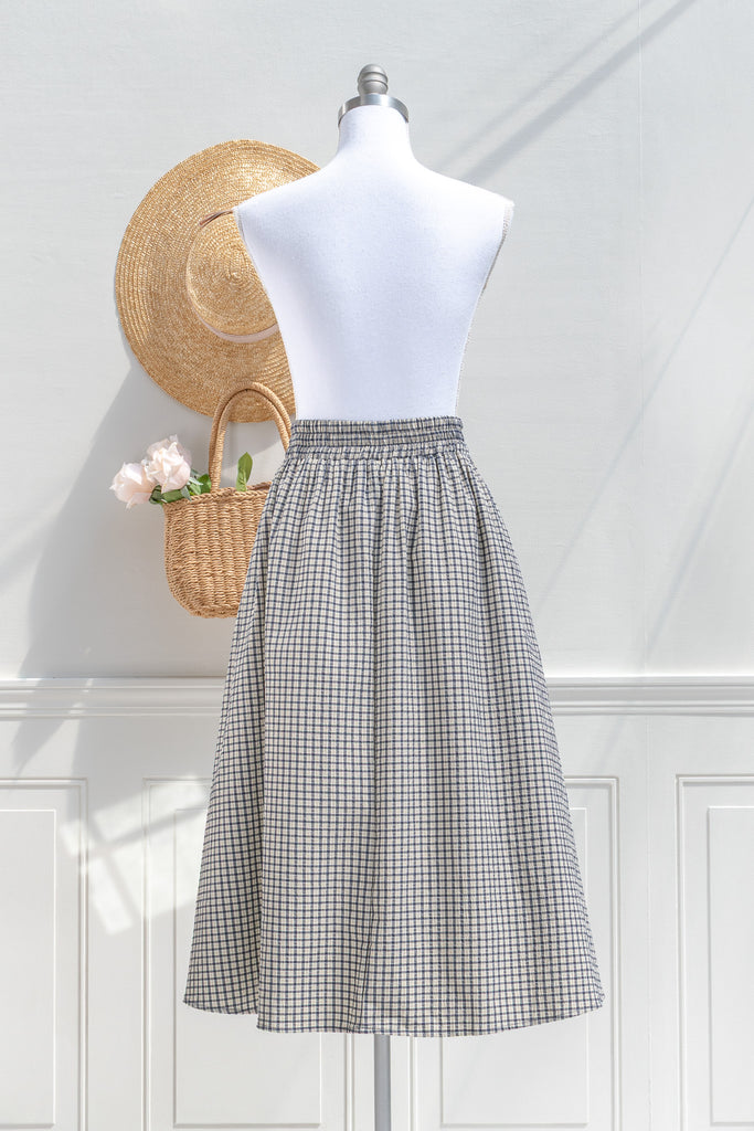 Arden navy check skirt — back view with elasticized waistband and clean seams