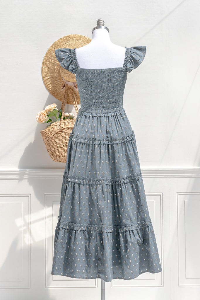 Camille dusty blue floral midi dress — back view with smocked bodice and clean tiers