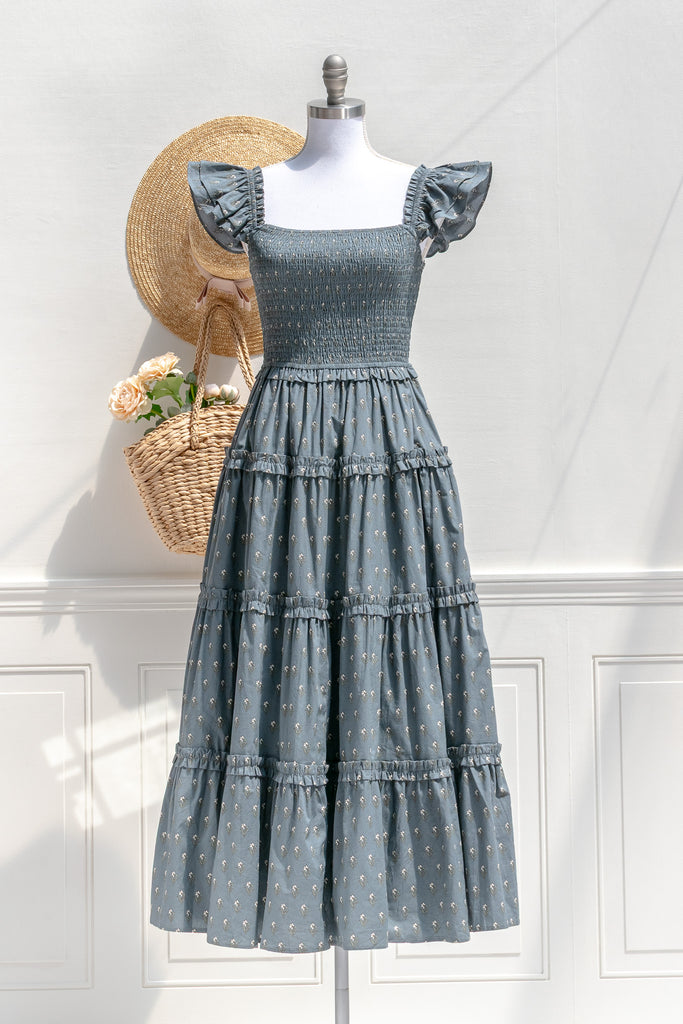 Amantine Camille dusty blue floral smocked midi dress with ruffled shoulders and tiered skirt — front view