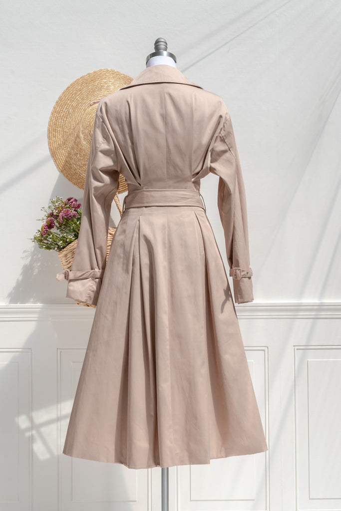 Charlotte sand trench coat — back view with full skirt and clean seams
