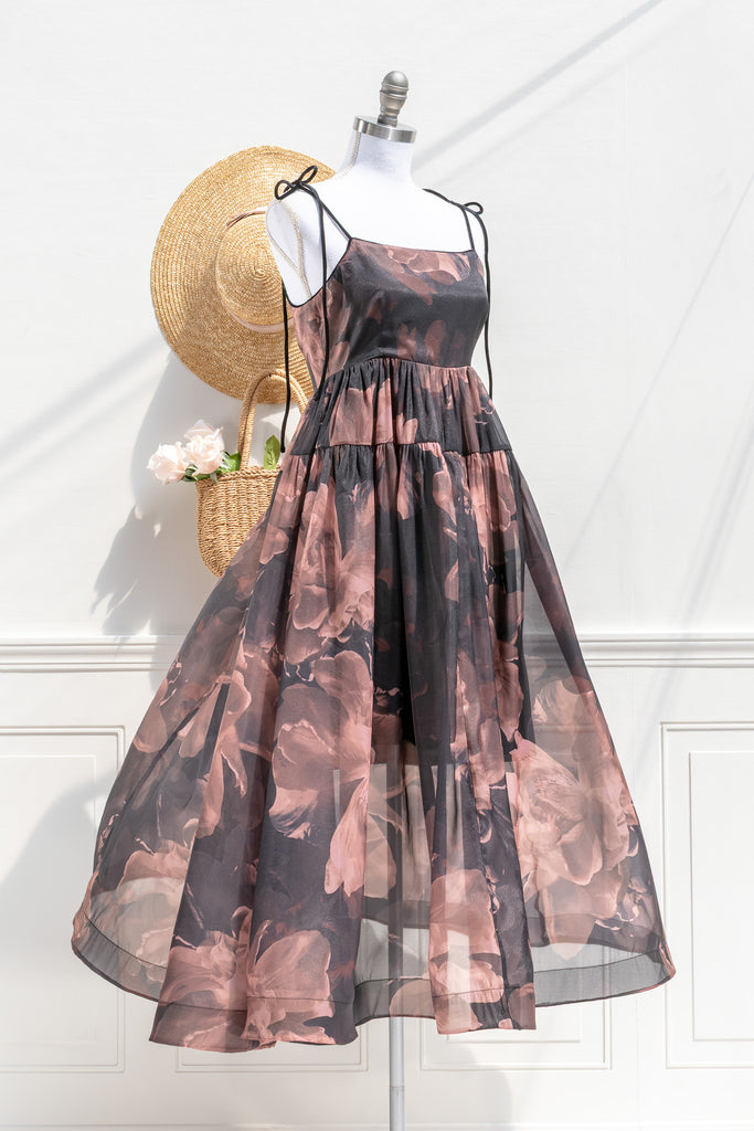 Delaney abstract floral organza midi dress — three-quarter view showing tie shoulders and flowing silhouette
