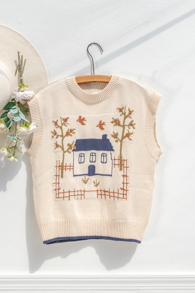 Amantine Homestead house-motif sweater vest in cream—oversized sleeveless fit and cropped length, front view