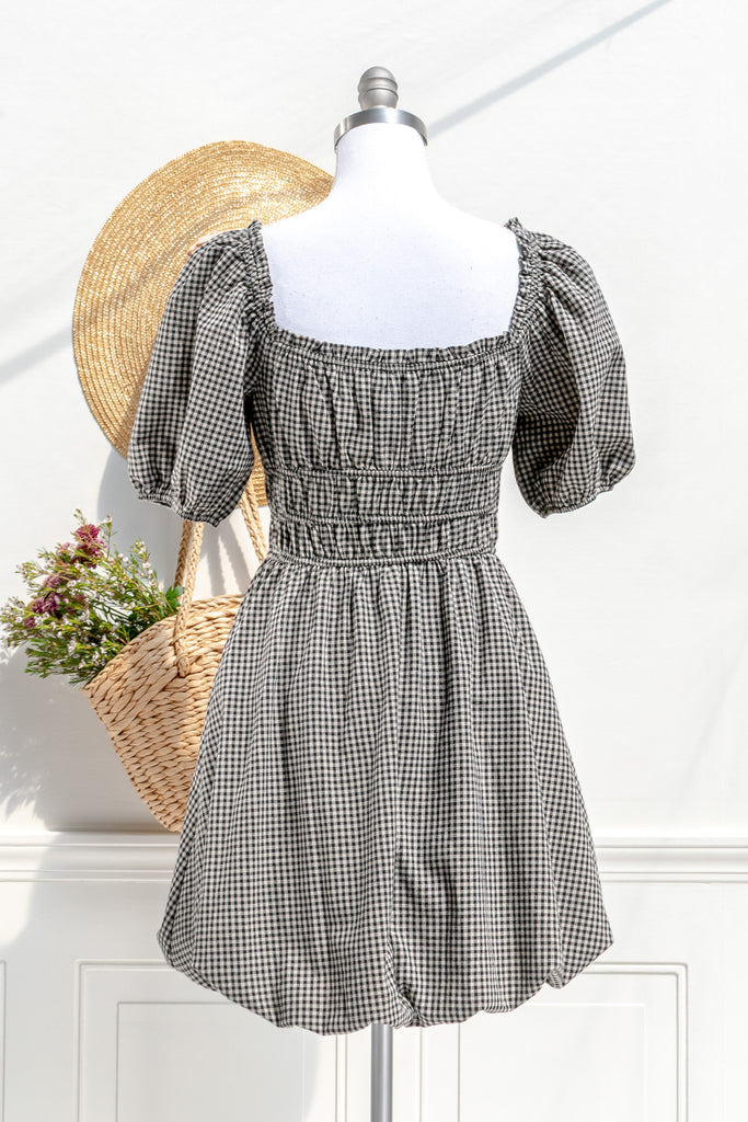 Lucie gingham mini dress — back view with gathered waist and clean checks