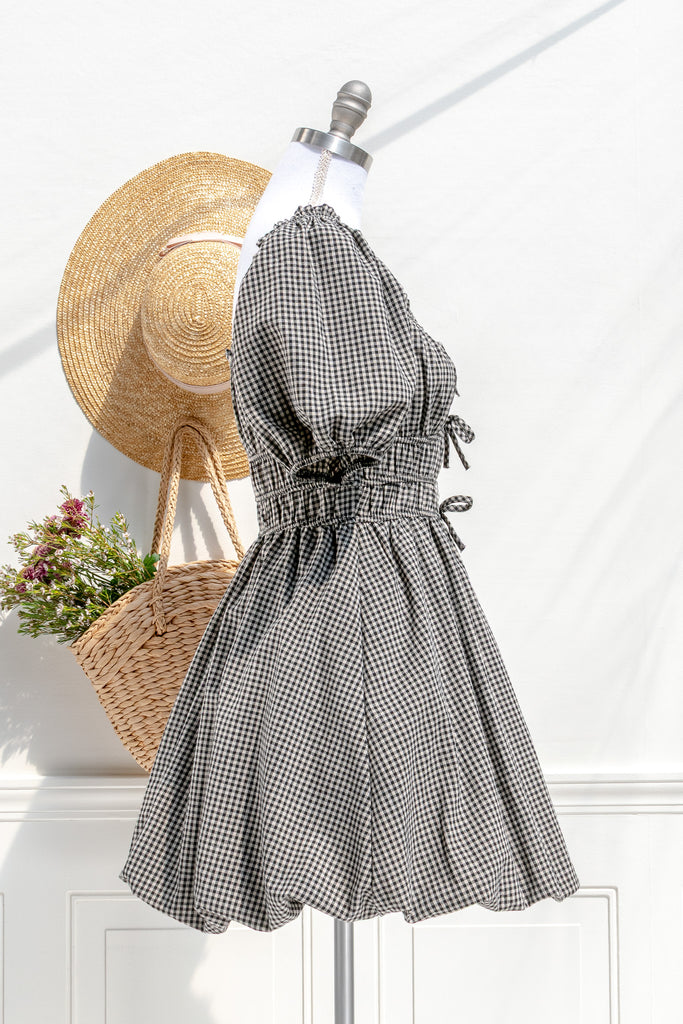 Lucie gingham bubble mini — side view with puff sleeve and softly structured hem