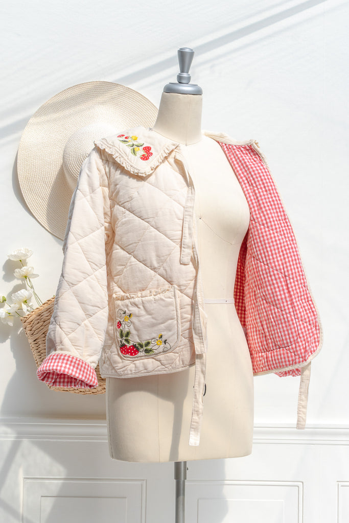 Red-and-white gingham lining inside the Mari quilted jacket