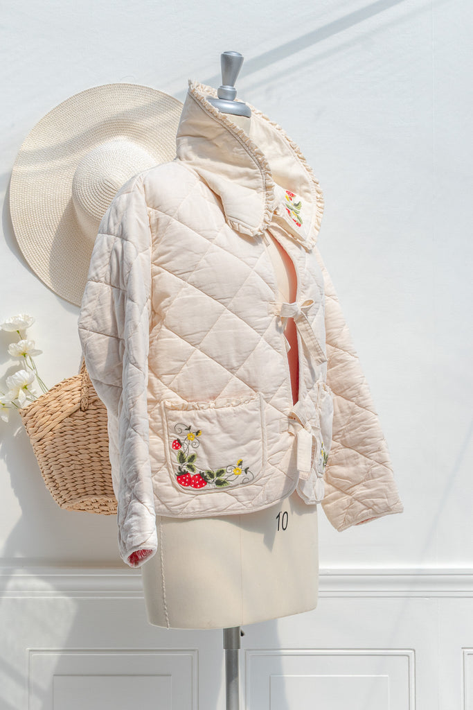 Mari embroidered quilted jacket — side view with soft drape and tie closures
